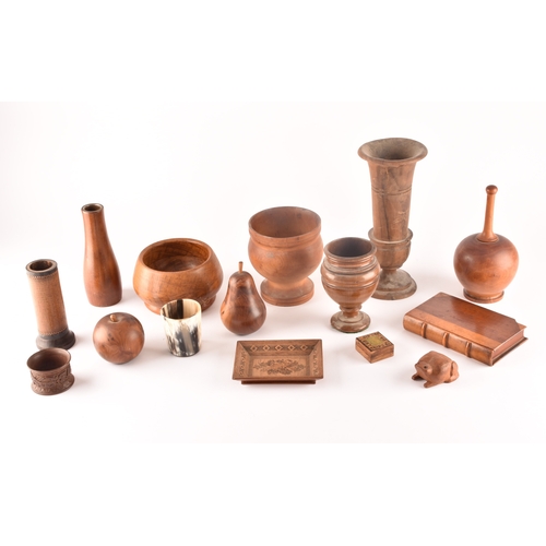 328 - A collection of assorted carved wooden treen items, including vases, cups, bowls, carved fruit, a ca... 