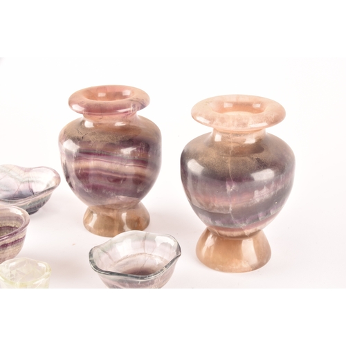 329 - Two carved fluorite urns, one 14 cm high, the other 13 cm high, together with a small collection of ... 