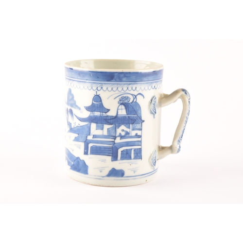 235 - A 19th century Chinese blue and white porcelain tankard, decoration depicting a rural coastal villag... 