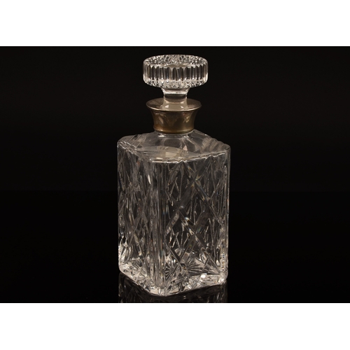 190 - A silver mounted cut crystal glass whisky decanter and stopper, with silver mounted collar, hallmark... 