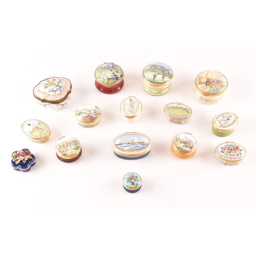 129 - A collection of enamel pill boxes of varying shapes and sizes, including maker's such as Halcyon Day... 