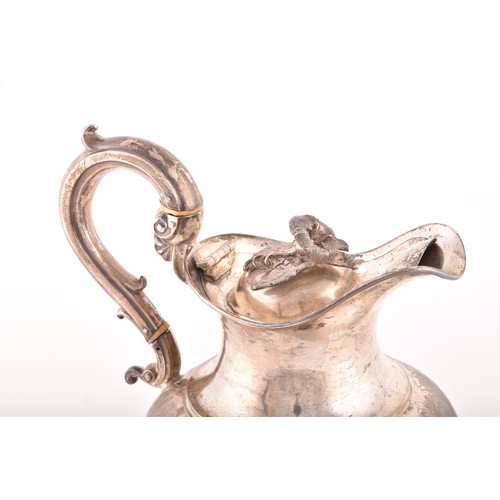 160 - A William IV silver ewer, hallmarked for London 1837 by J E Terrey & Co, with ornate scrolling d... 