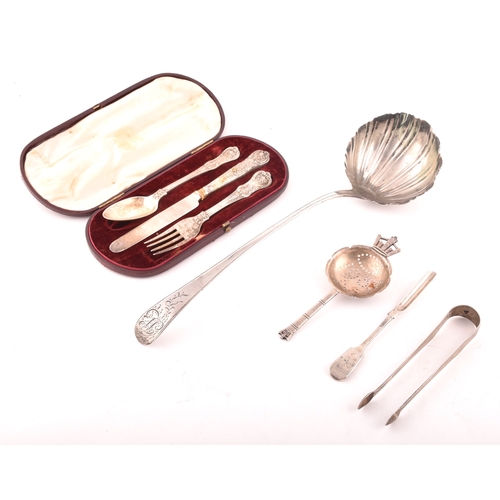 162 - A group of assorted silver items, including a Georgian silver ladle with round shell bowl, old Engli... 