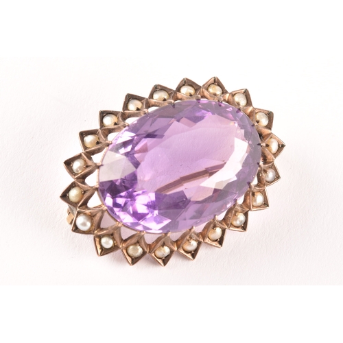 93 - A yellow metal Amethyst and pearl seed brooch, set to centre with a oval amethyst with an approximat... 