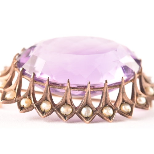 93 - A yellow metal Amethyst and pearl seed brooch, set to centre with a oval amethyst with an approximat... 