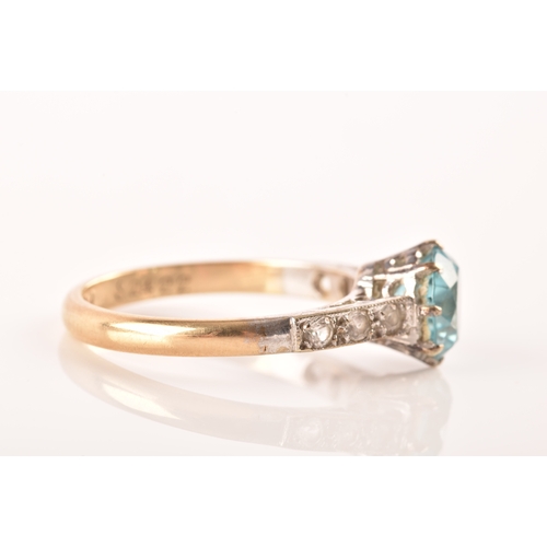 95 - An 9ct yellow gold and white metal solitaire ring, set to centre with a round cut zircon with an app... 