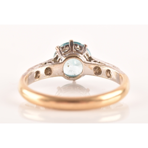 95 - An 9ct yellow gold and white metal solitaire ring, set to centre with a round cut zircon with an app... 