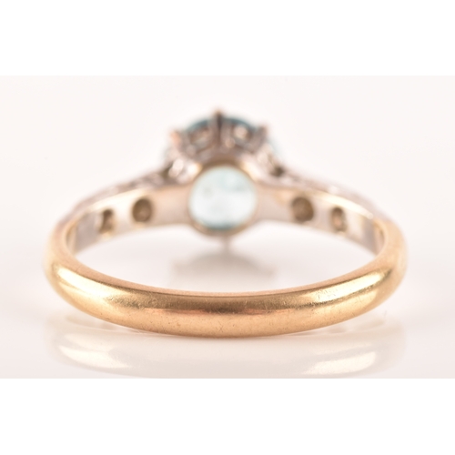 95 - An 9ct yellow gold and white metal solitaire ring, set to centre with a round cut zircon with an app... 