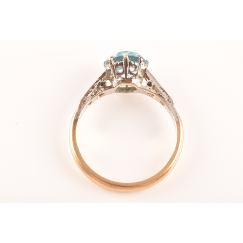 95 - An 9ct yellow gold and white metal solitaire ring, set to centre with a round cut zircon with an app... 