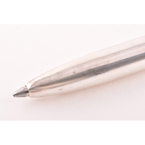 130 - A sterling silver slim ball point pen with feature large hallmarks for London 2003 by Braybrook &... 