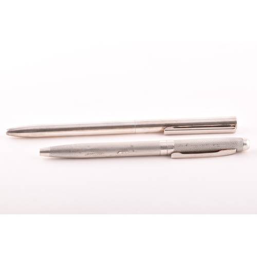 130 - A sterling silver slim ball point pen with feature large hallmarks for London 2003 by Braybrook &... 