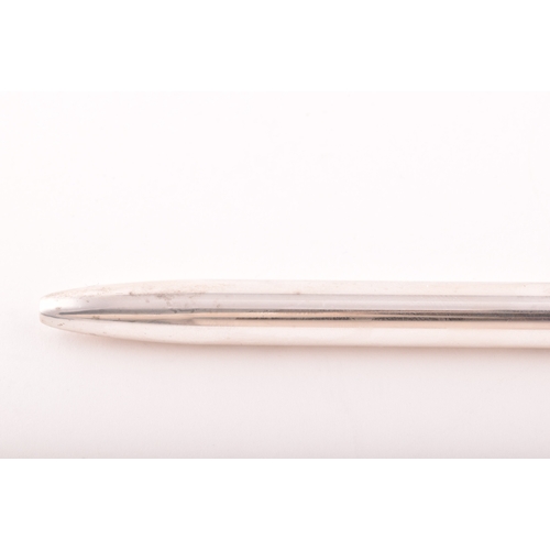 130 - A sterling silver slim ball point pen with feature large hallmarks for London 2003 by Braybrook &... 