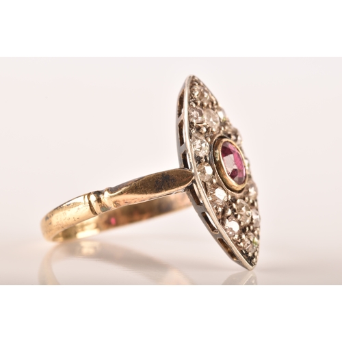 101 - A 18ct yellow gold and silver marquise cluster ring, set to centre with a oval old cut ruby with an ... 