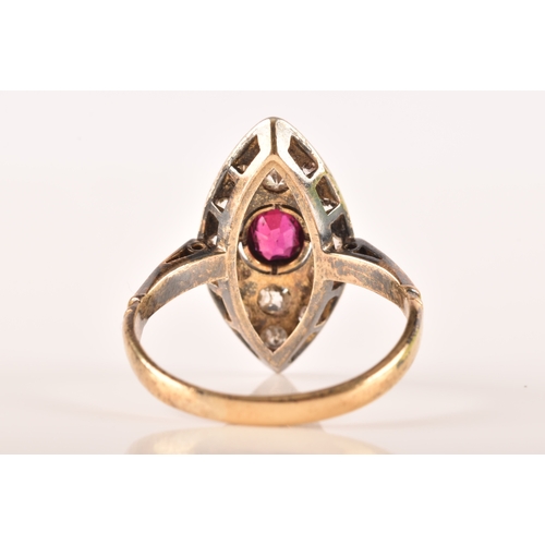 101 - A 18ct yellow gold and silver marquise cluster ring, set to centre with a oval old cut ruby with an ... 