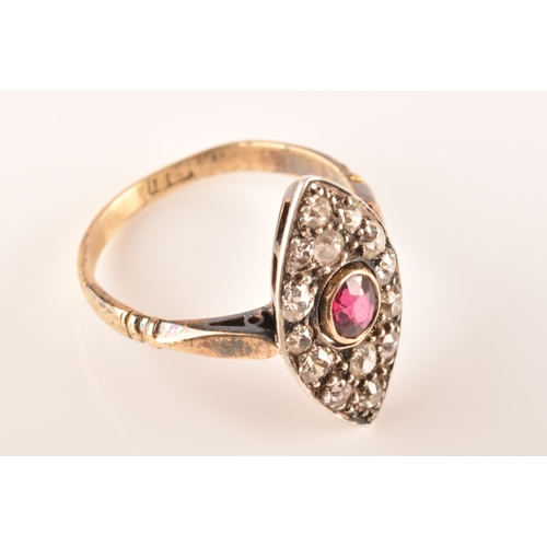 101 - A 18ct yellow gold and silver marquise cluster ring, set to centre with a oval old cut ruby with an ... 