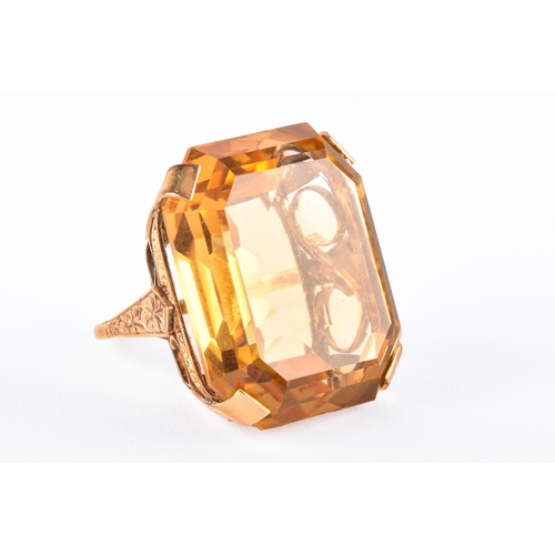 102 - A vintage 18ct yellow gold cocktail ring, set to centre with a octagonal citrine measuring approxima... 