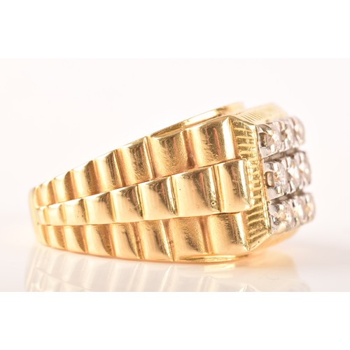 85 - An 18ct yellow gold signet ring, set with nine round brilliant cut diamonds with a combined approxim... 