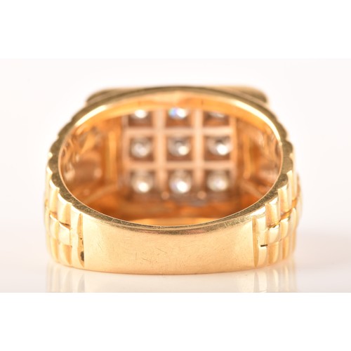 85 - An 18ct yellow gold signet ring, set with nine round brilliant cut diamonds with a combined approxim... 