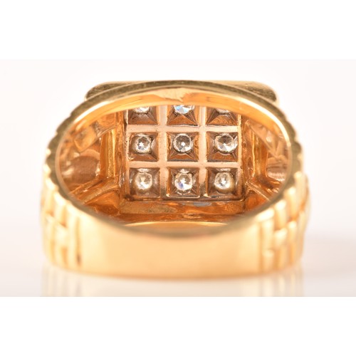 85 - An 18ct yellow gold signet ring, set with nine round brilliant cut diamonds with a combined approxim... 