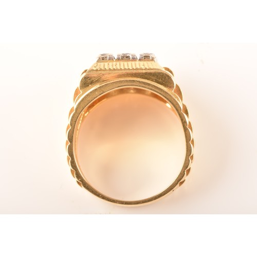 85 - An 18ct yellow gold signet ring, set with nine round brilliant cut diamonds with a combined approxim... 