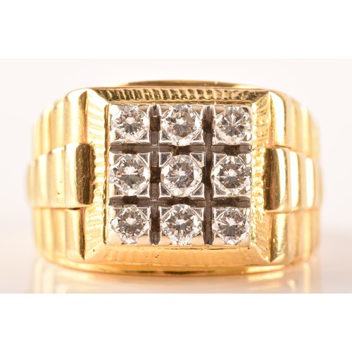 85 - An 18ct yellow gold signet ring, set with nine round brilliant cut diamonds with a combined approxim... 