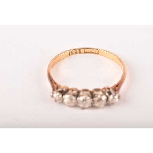 106 - An early 20th century 18ct yellow gold and platinum diamond five stone ring, set with five round old... 