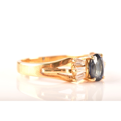 107 - A 18ct yellow gold sapphire and diamond ring, set to centre with a oval sapphire with an approximate... 