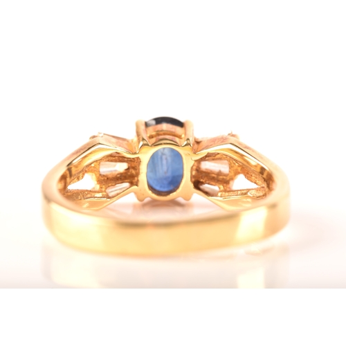 107 - A 18ct yellow gold sapphire and diamond ring, set to centre with a oval sapphire with an approximate... 