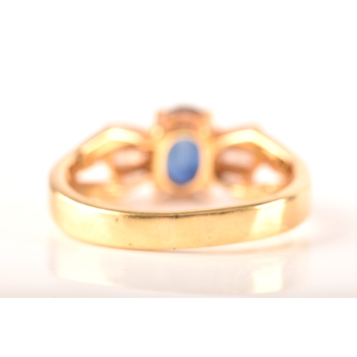 107 - A 18ct yellow gold sapphire and diamond ring, set to centre with a oval sapphire with an approximate... 