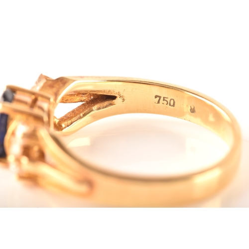 107 - A 18ct yellow gold sapphire and diamond ring, set to centre with a oval sapphire with an approximate... 