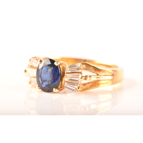 107 - A 18ct yellow gold sapphire and diamond ring, set to centre with a oval sapphire with an approximate... 