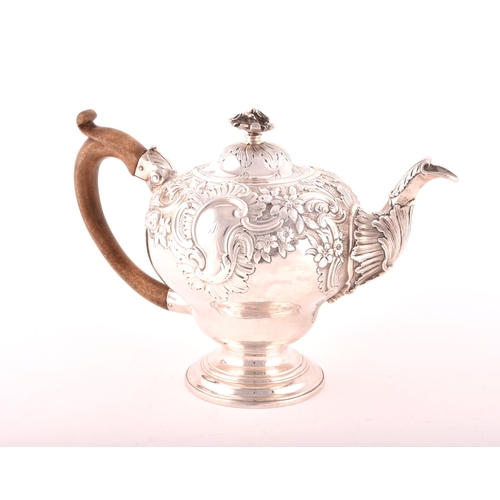 157 - A George III silver teapot, hallmarked for London 1769, possibly by Charles Wright, intricate foliat... 