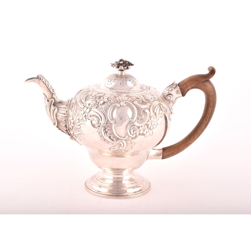 157 - A George III silver teapot, hallmarked for London 1769, possibly by Charles Wright, intricate foliat... 