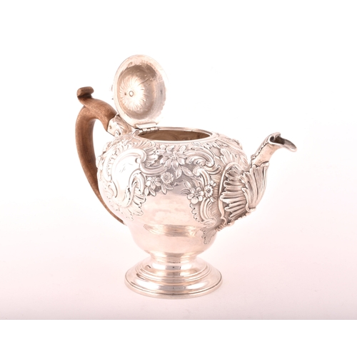 157 - A George III silver teapot, hallmarked for London 1769, possibly by Charles Wright, intricate foliat... 