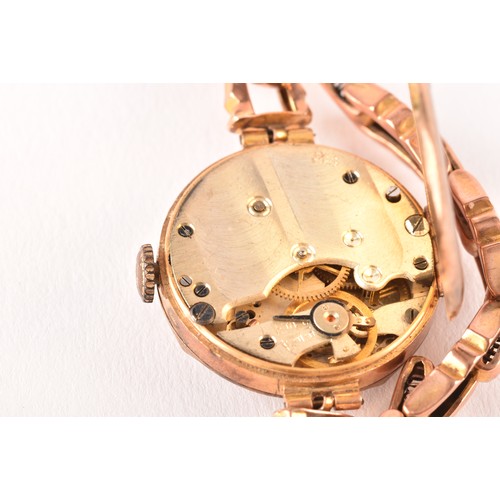 136 - A ladies 9ct yellow gold mechanical wristwatch, with gilt dial, 9ct gold case and a 9ct rose gold fl... 