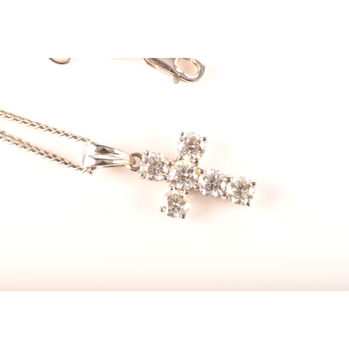 112 - An 18ct white gold diamond cross pendant, set with six brilliant cut diamonds with a combined approx... 