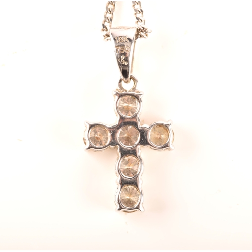 112 - An 18ct white gold diamond cross pendant, set with six brilliant cut diamonds with a combined approx... 