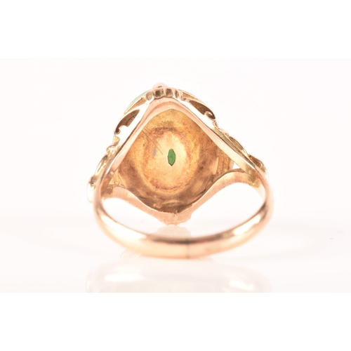 113 - A yellow metal dress ring, set with a cabochon oval jade measuring approximately 14mm length x 10.5m... 