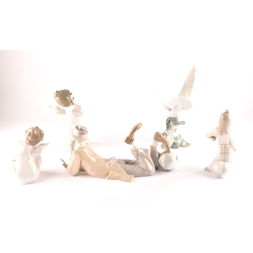 262 - A group of Lladro figures, including a daydreaming angel, a clown, a mime angel, a large turtle dove... 