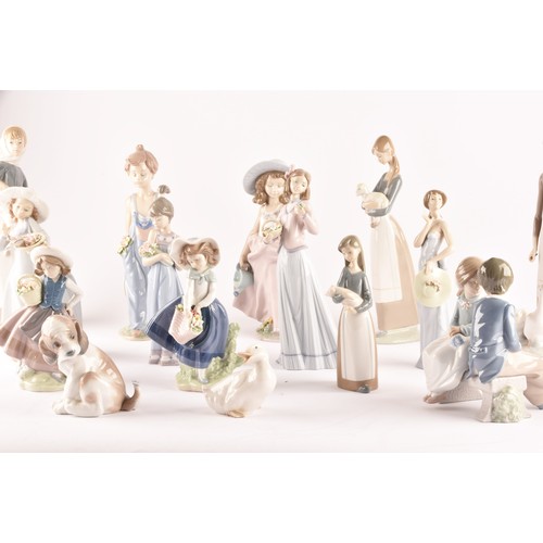 264 - A large collection of Lladro, including fourteen female figurines, a puppy, a Lladro society scroll,... 