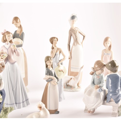 264 - A large collection of Lladro, including fourteen female figurines, a puppy, a Lladro society scroll,... 