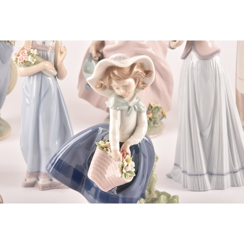 264 - A large collection of Lladro, including fourteen female figurines, a puppy, a Lladro society scroll,... 