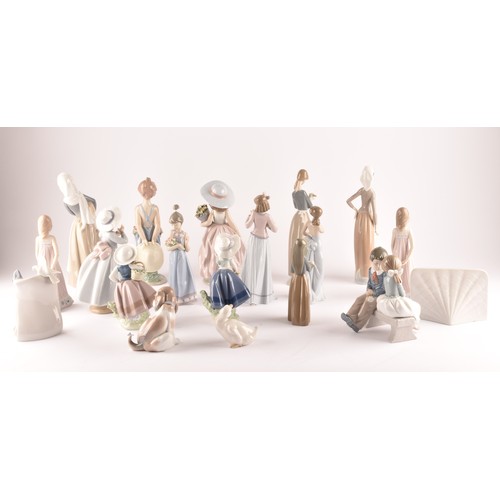 264 - A large collection of Lladro, including fourteen female figurines, a puppy, a Lladro society scroll,... 