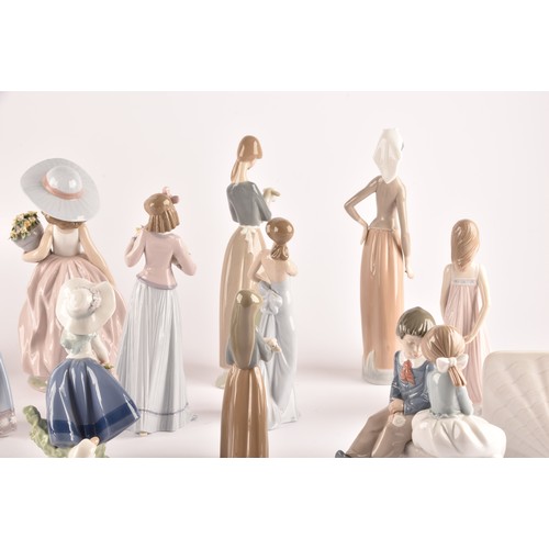 264 - A large collection of Lladro, including fourteen female figurines, a puppy, a Lladro society scroll,... 