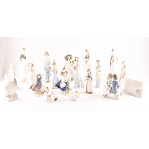 264 - A large collection of Lladro, including fourteen female figurines, a puppy, a Lladro society scroll,... 