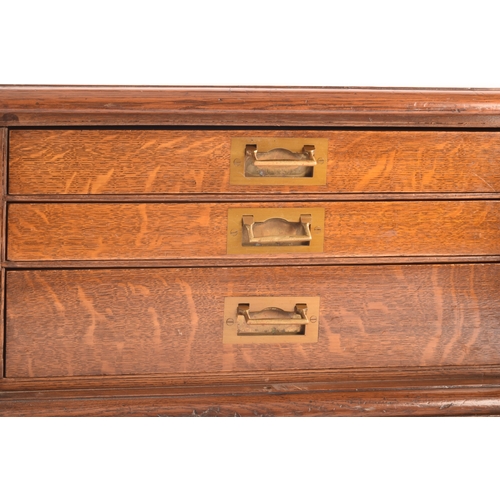 170 - An early 20th century oak cased canteen of cutlery, with three drawers including twelve places setti... 