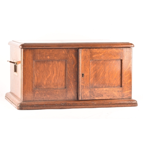 170 - An early 20th century oak cased canteen of cutlery, with three drawers including twelve places setti... 