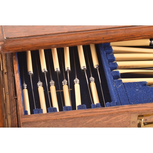 170 - An early 20th century oak cased canteen of cutlery, with three drawers including twelve places setti... 