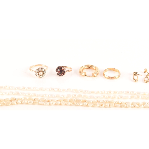 122 - A group of 9ct yellow gold jewellery, including a garnet ring, a tri-colour wedding band, a pearl co... 