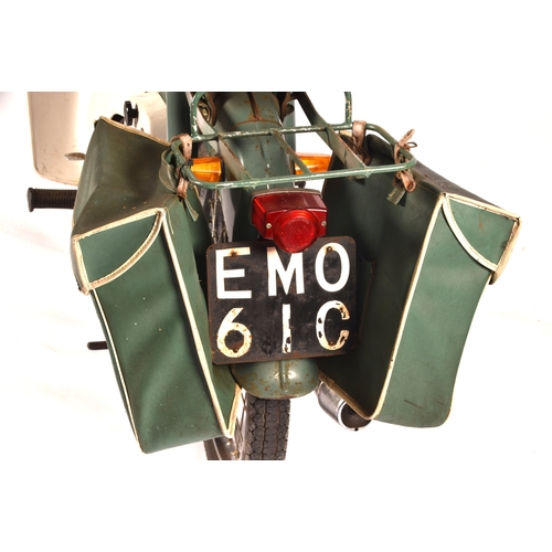 311 - A 1965 Honda C50 50cc moped, registration: EMO 61C, in green, with windshield and rear rack with pan... 